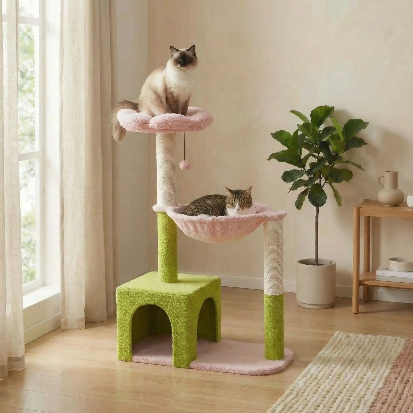 chats qui se reposent sur ce petit arbre a chat rose et vert